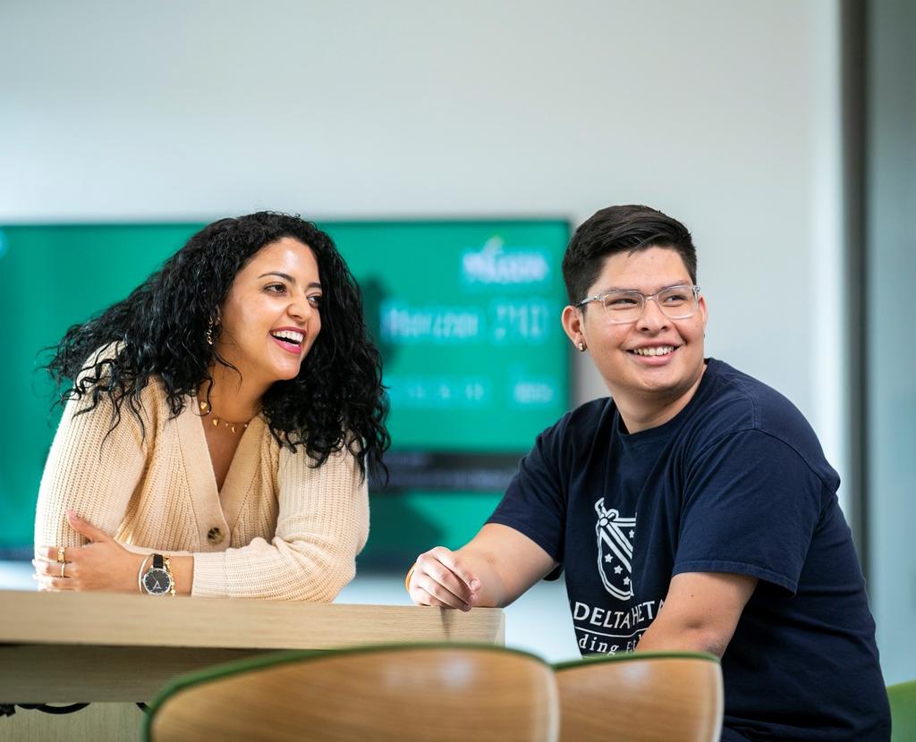 Two undergraduate students smiling